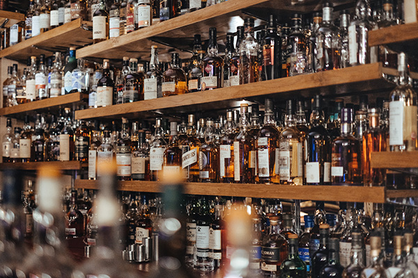 photo of a whiskey bar showing the variety and complexity of whiskey